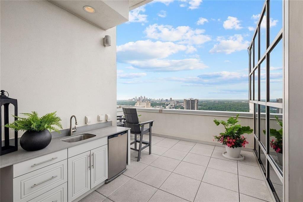 2828 Peachtree Road Northwest, Unit P 3300 Atlanta, GA 30305 - Photo 49 of 62 a view of a terrace with seating space
