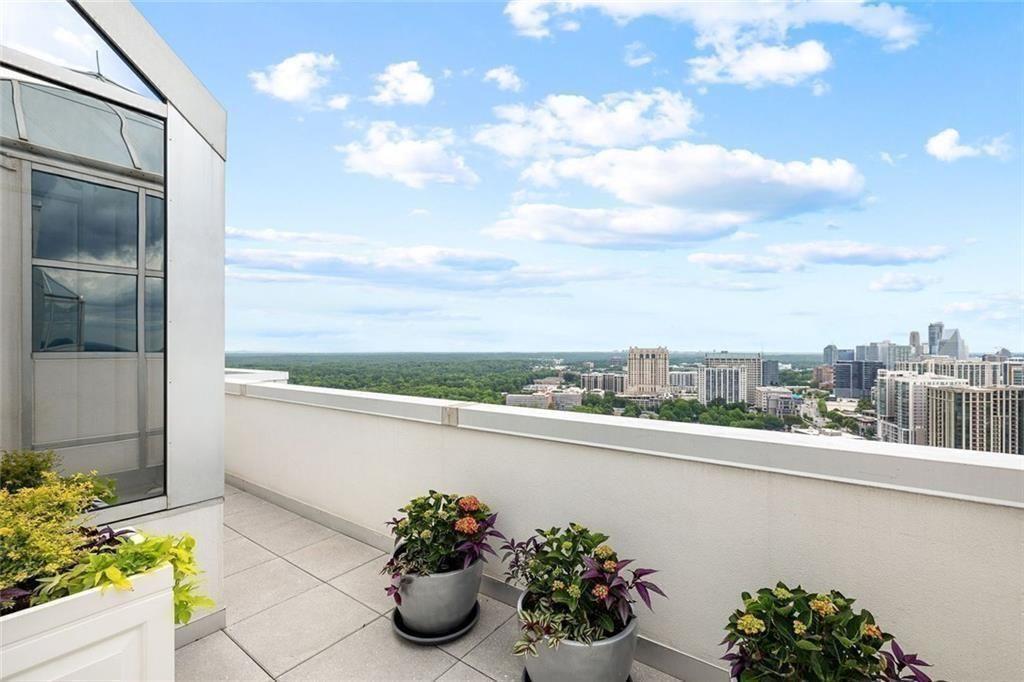 2828 Peachtree Road Northwest, Unit P 3300 Atlanta, GA 30305 - Photo 50 of 62 a view of a balcony with flower pots