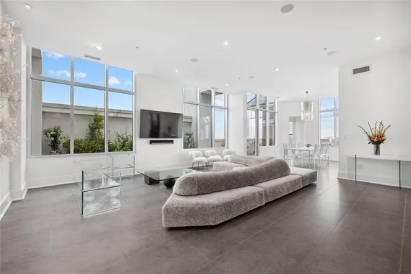 a very nice looking dining room with a large window