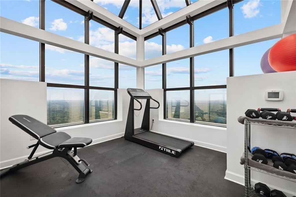 2828 Peachtree Road Northwest, Unit P 3300 Atlanta, GA 30305 - Photo 51 of 62 a room with gym equipment and a window