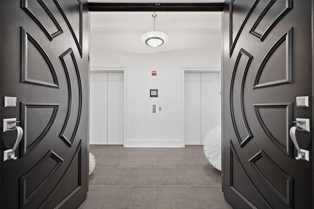 2828 Peachtree Road Northwest, Unit P 3300 Atlanta, GA 30305 - Photo 52 of 62 a view of an entryway with wooden floor