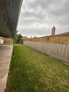 a view of a pathway with a yard