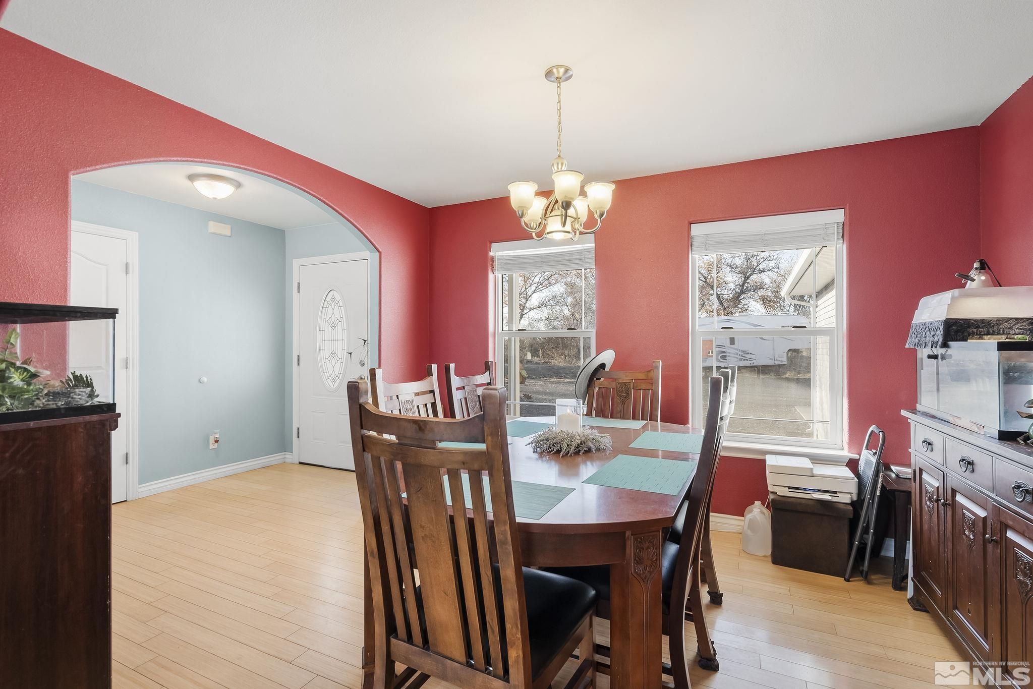 529 McLean Road Fallon, NV 89406 - Photo 8 of 19 a view of a dining room with furniture window and wooden floor