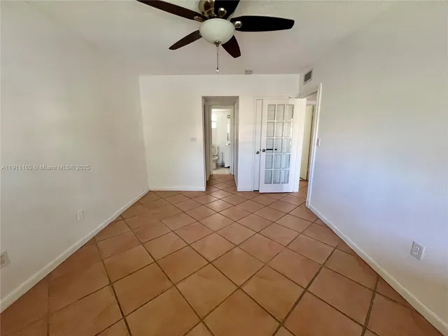 a view of entryway with kitchen