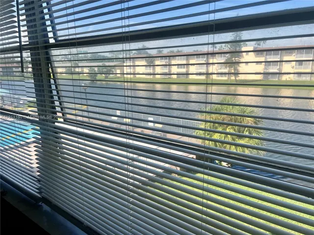 a bathroom with a sink vanity and toilet