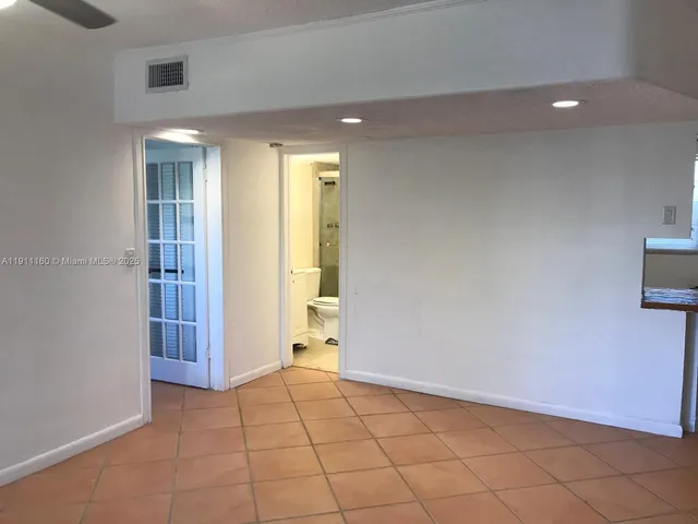 a view of an empty room and window