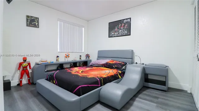 a bedroom with furniture and a bed