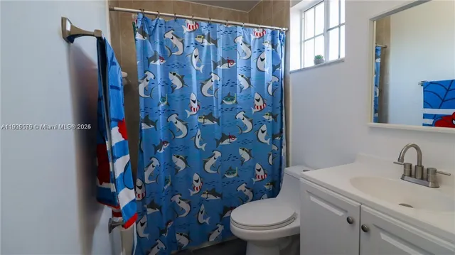 a bathroom with a toilet and a sink