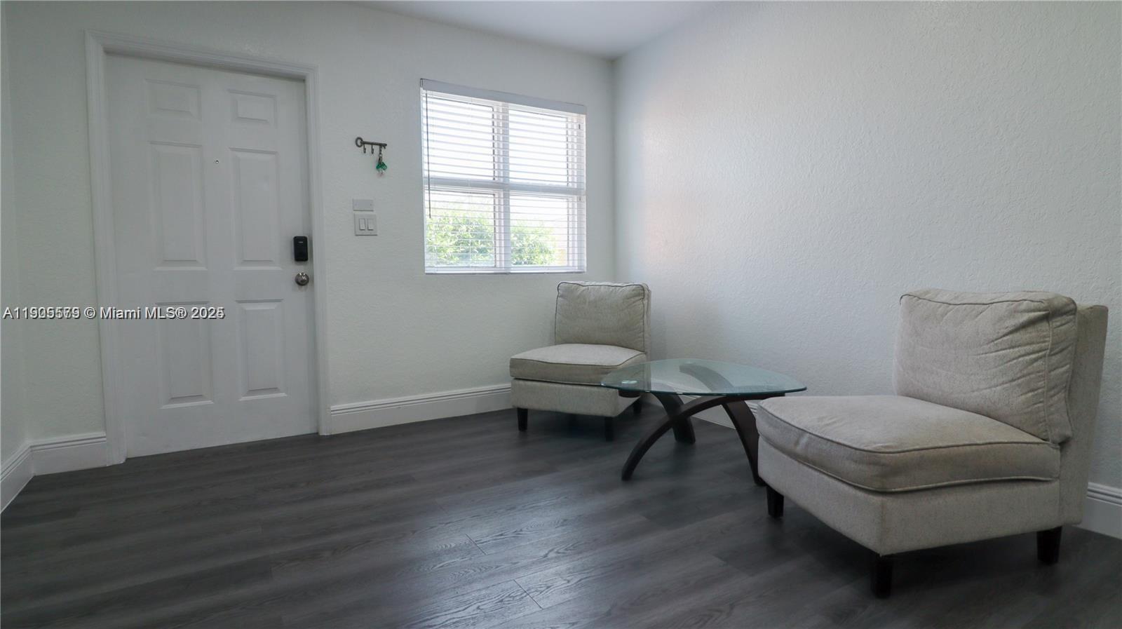 15330 Southwest 134th Place, Unit 308 Miami, FL 33177 - Photo 2 of 29 a living room with furniture and a window