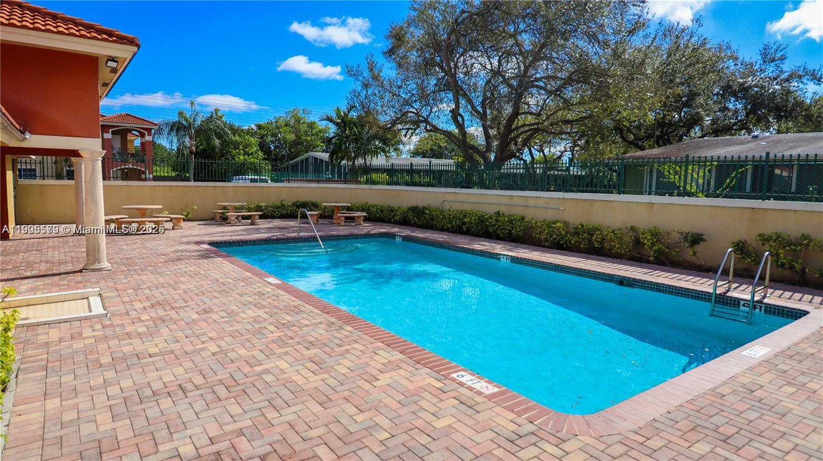 15330 Southwest 134th Place, Unit 308 Miami, FL 33177 - Photo 27 of 29 a view of swimming pool with chairs