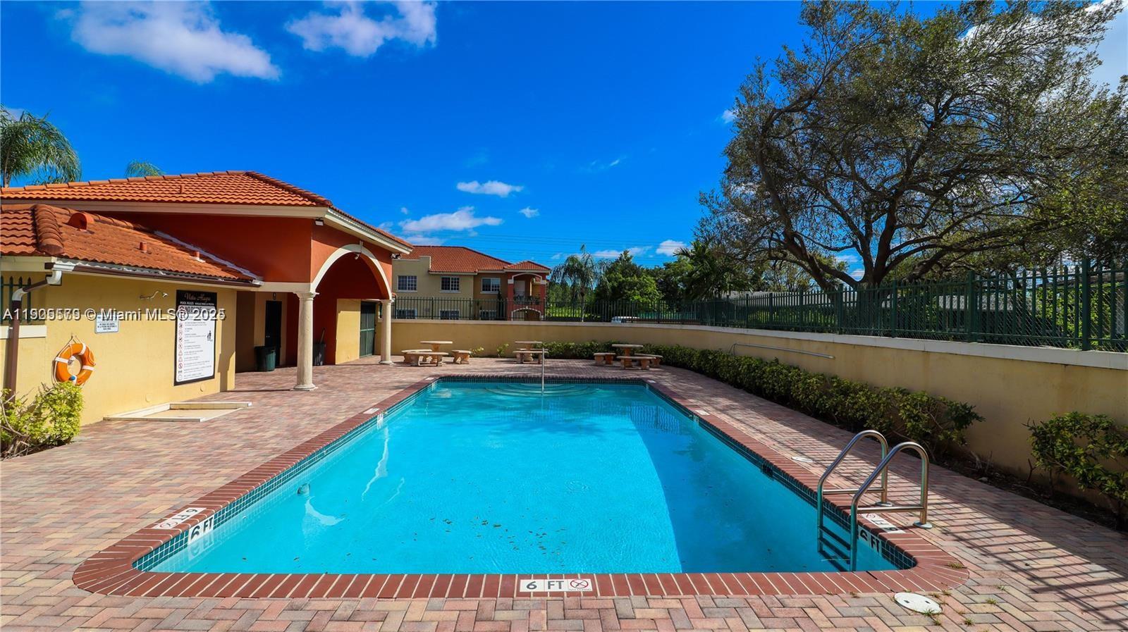 15330 Southwest 134th Place, Unit 308 Miami, FL 33177 - Photo 28 of 29 a view of swimming pool with lounge chair