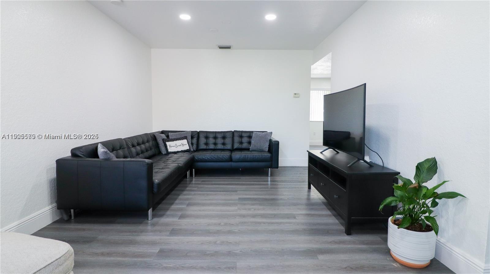 15330 Southwest 134th Place, Unit 308 Miami, FL 33177 - Photo 4 of 29 a living room with furniture