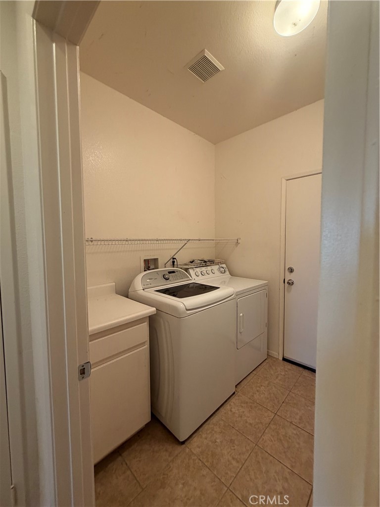 24972 Butterchurn Road Wildomar, CA 92595 - Photo 14 of 45 Separate Washer and Dryer Room with view of Garage Door