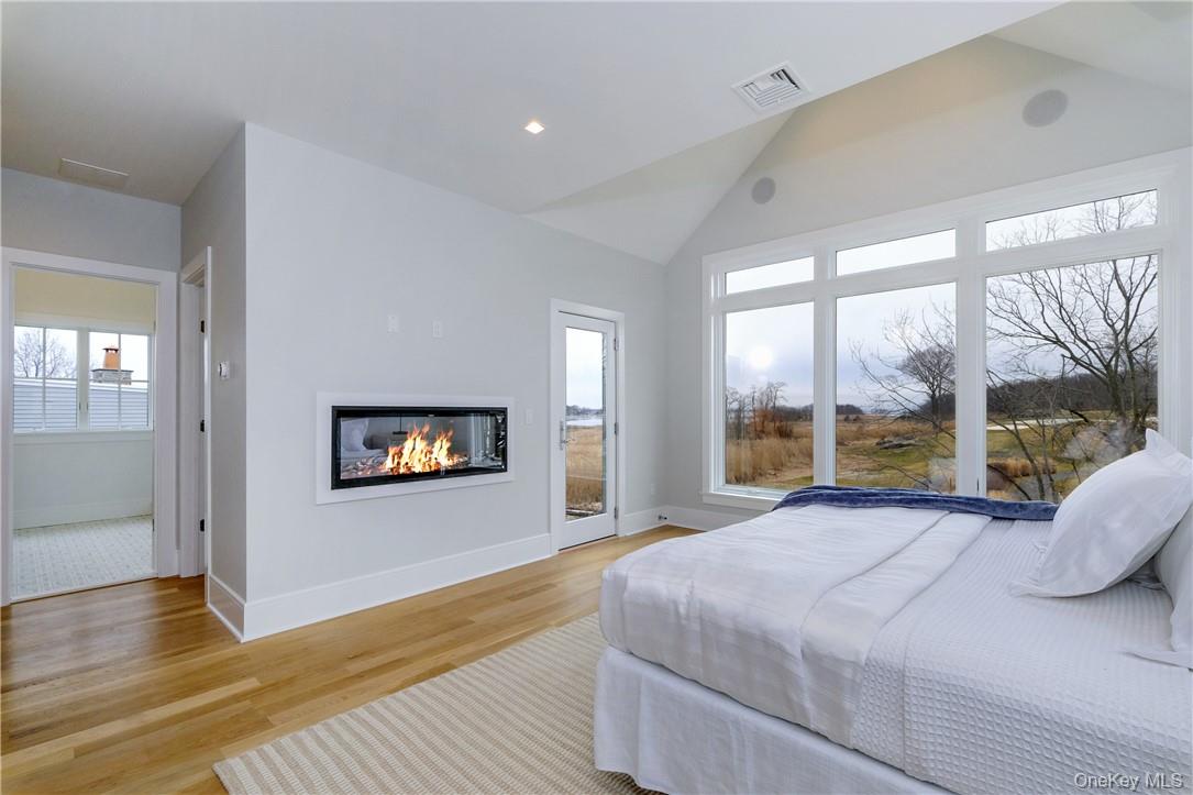 184 Soundview Avenue Rye, NY 10580 - Photo 18 of 35 Primary Bedroom w/ fireplace & deck