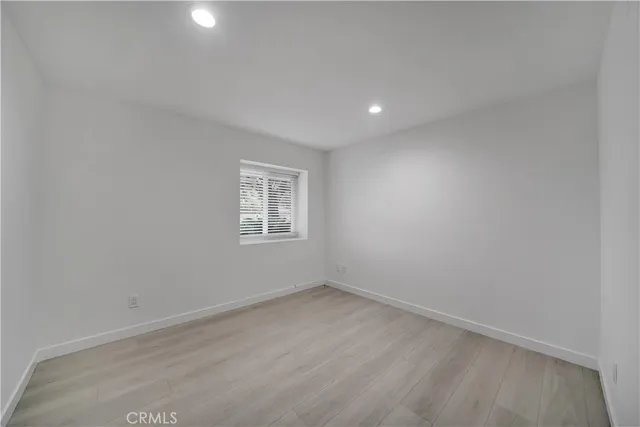 a bathroom with a toilet a sink and a mirror