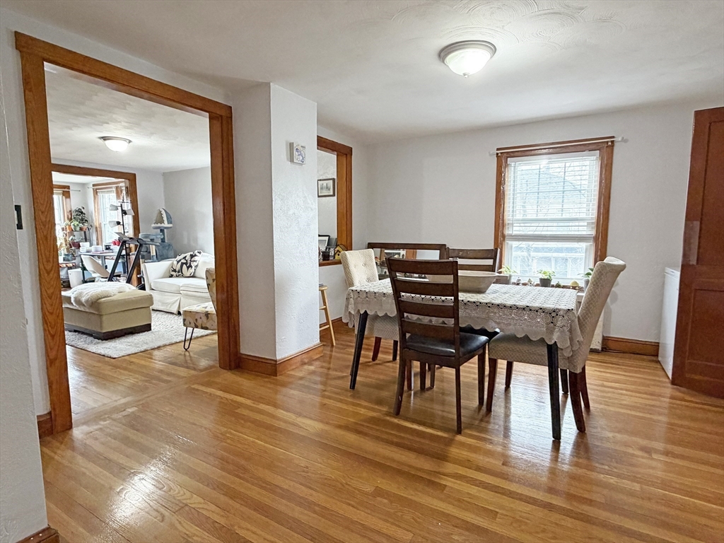 75-77 Dale Street, Unit 77 Waltham, MA 02451 - Photo 6 of 17 a view of a dining room with furniture and wooden floor
