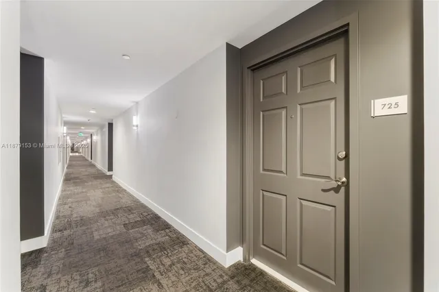 a view of hallway with chandelier