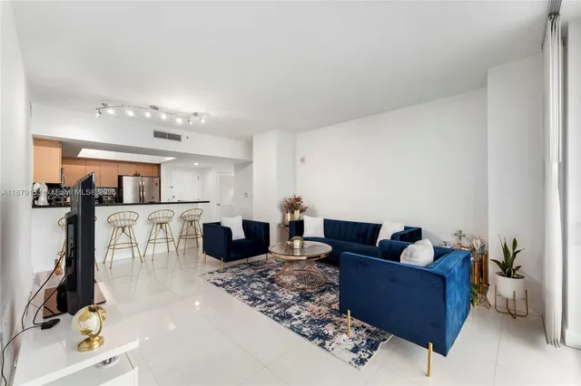 a kitchen with stainless steel appliances a refrigerator and a stove