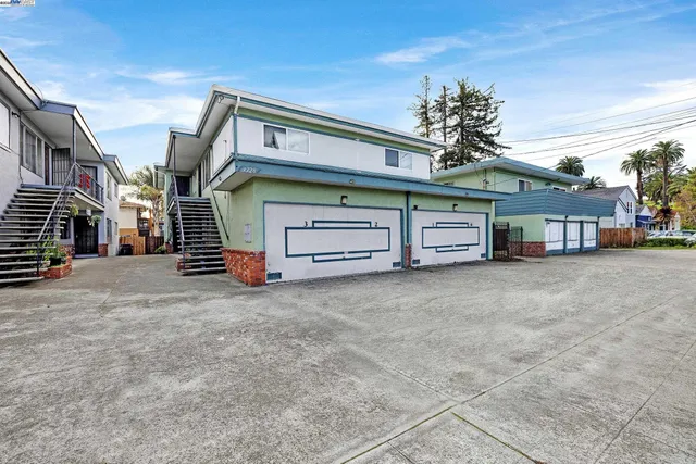 a view of a house with a yard and garage
