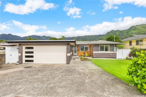 a view of house with outdoor space and sitting area