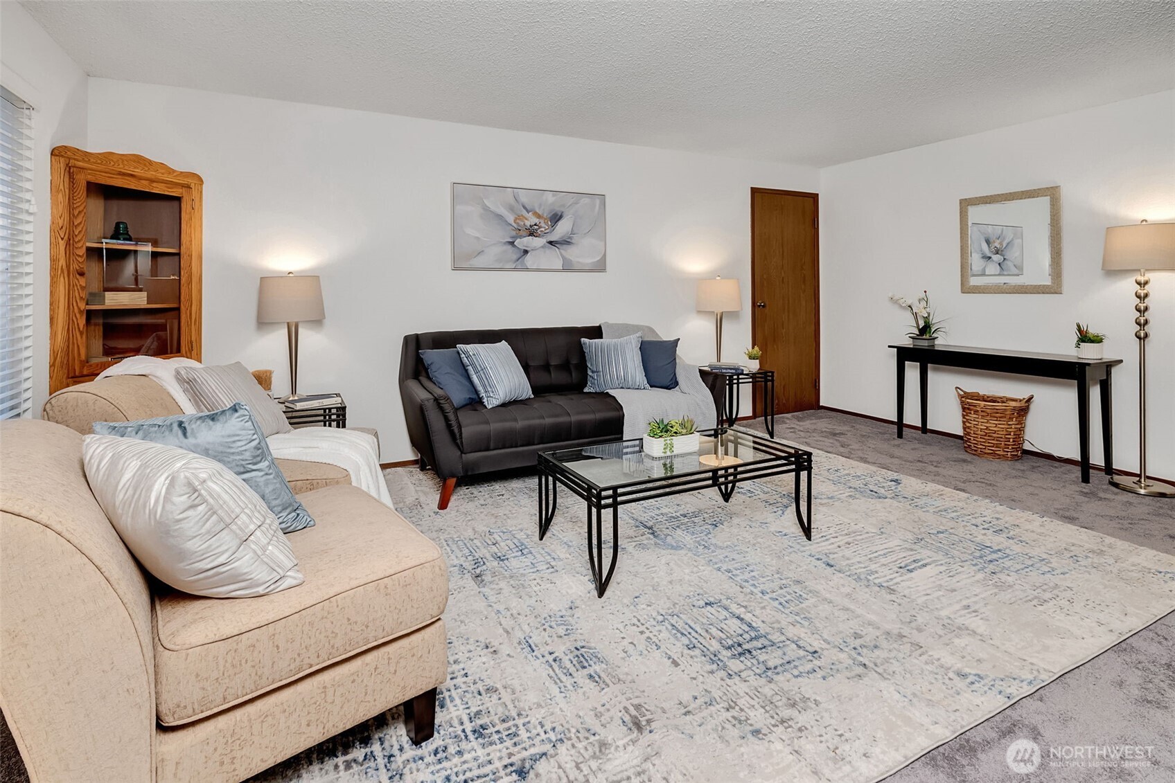 a living room with furniture and a rug