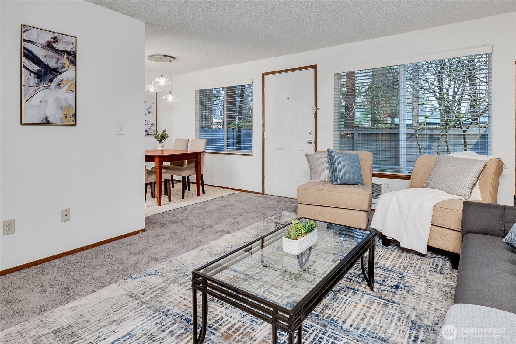 7520 208th Street Southwest, Unit A101 Edmonds, WA 98026 - Photo 11 of 27 a living room with furniture and a table
