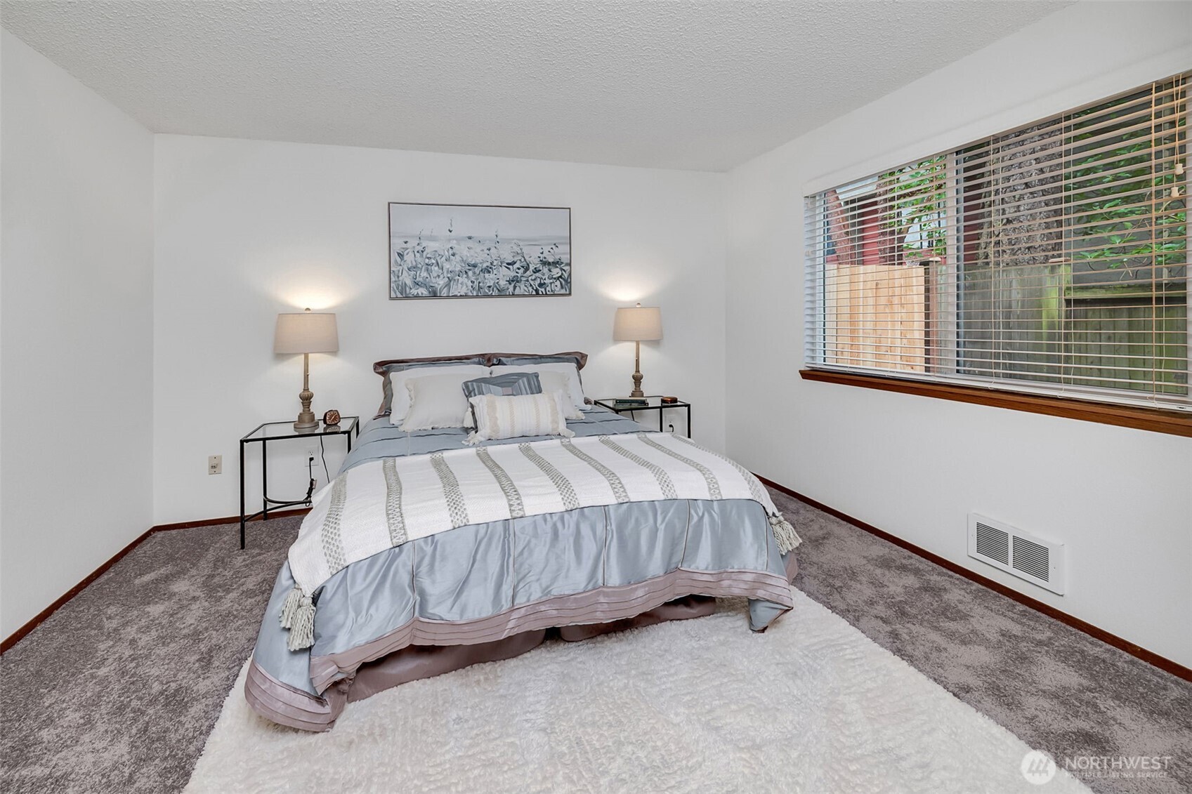 7520 208th Street Southwest, Unit A101 Edmonds, WA 98026 - Photo 19 of 27 a bedroom with a bed and a window