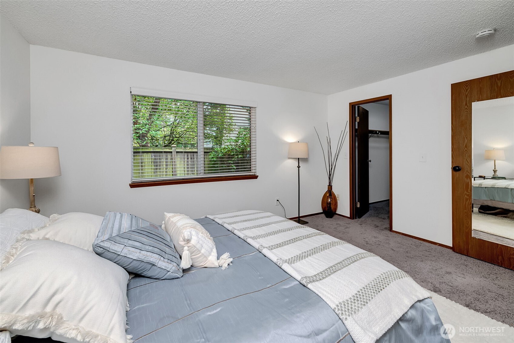 7520 208th Street Southwest, Unit A101 Edmonds, WA 98026 - Photo 21 of 27 a bedroom with a bed and a window