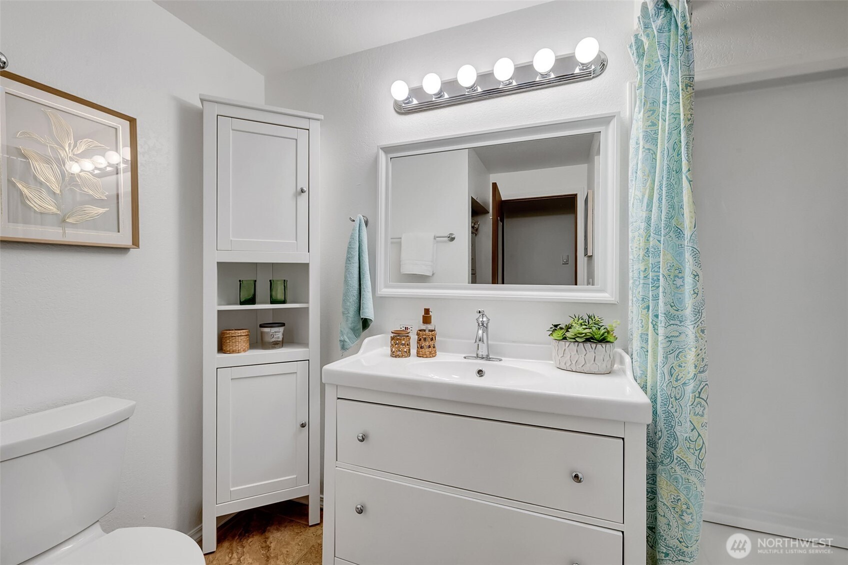7520 208th Street Southwest, Unit A101 Edmonds, WA 98026 - Photo 23 of 27 a bathroom with a toilet sink and mirror