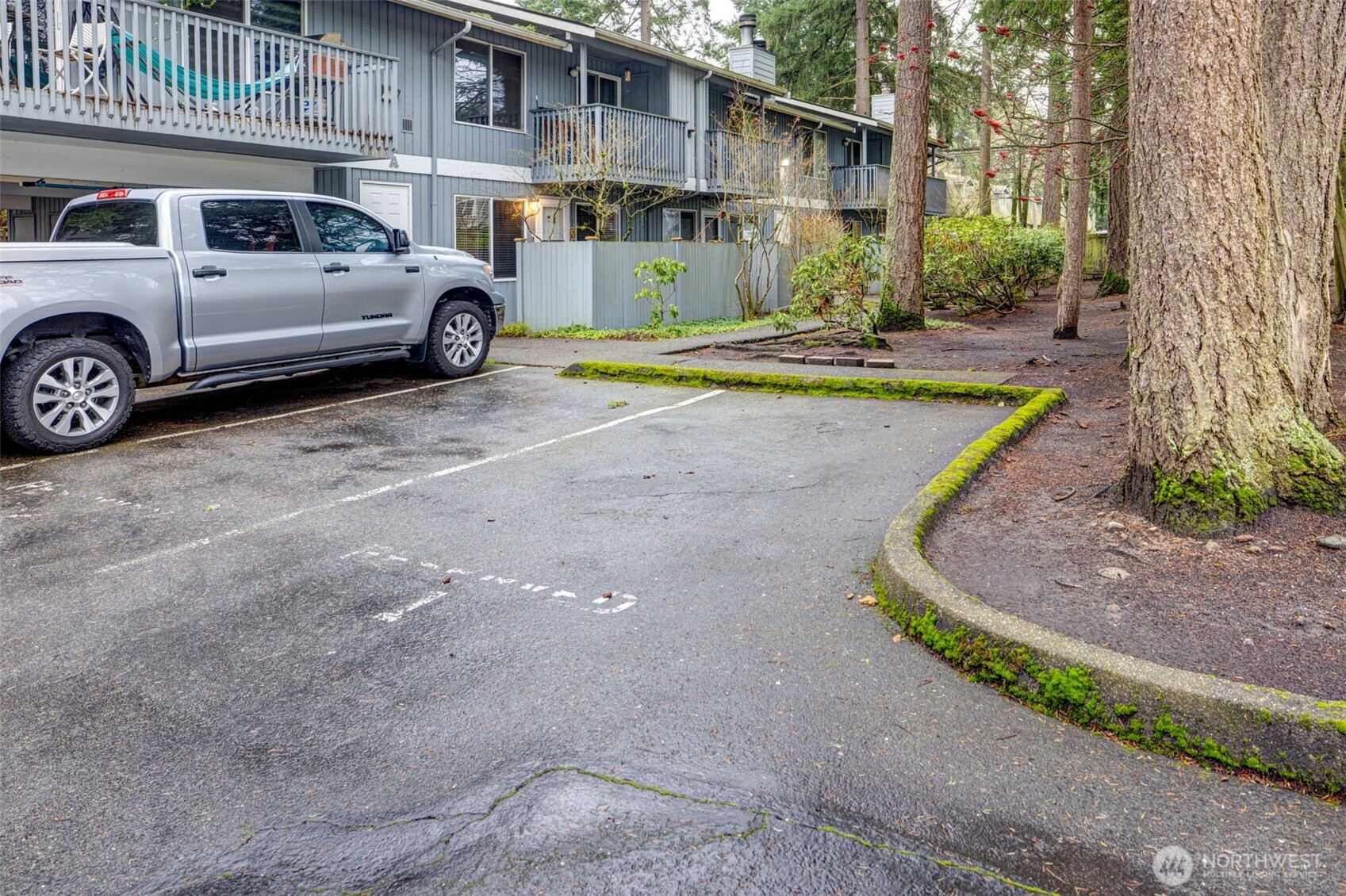 7520 208th Street Southwest, Unit A101 Edmonds, WA 98026 - Photo 27 of 27 a view of a car parked in front of a brick house