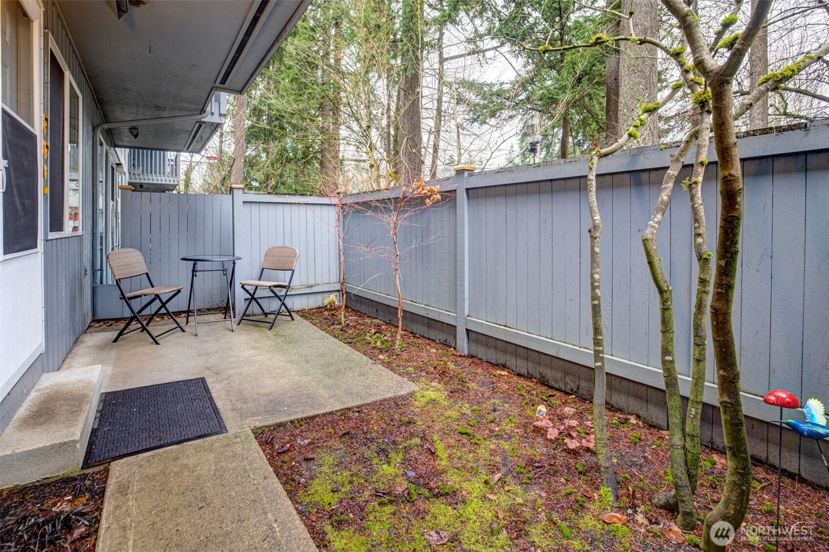 7520 208th Street Southwest, Unit A101 Edmonds, WA 98026 - Photo 3 of 27 a view of backyard with outdoor seating and trees