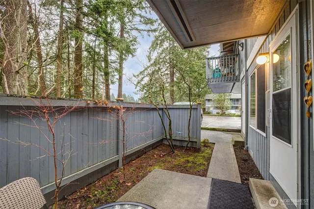 a view of a porch with wooden fence