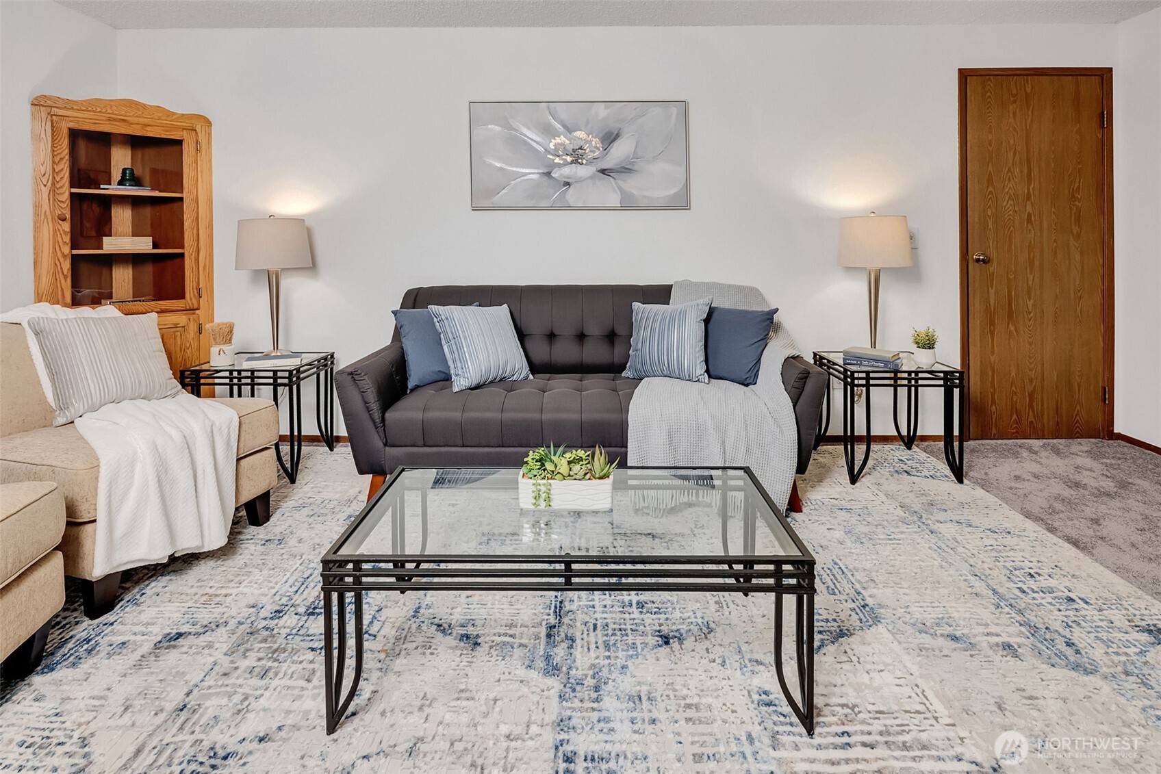 7520 208th Street Southwest, Unit A101 Edmonds, WA 98026 - Photo 6 of 27 a living room with furniture and a rug