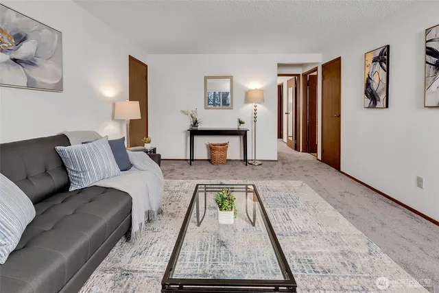 a living room with furniture and a table