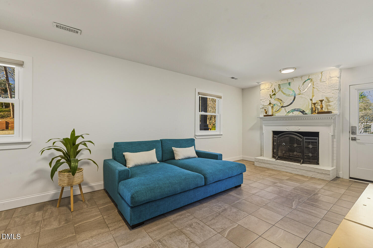 3704 Swann Street Raleigh, NC 27612 - Photo 13 of 21 a living room with furniture and a fireplace