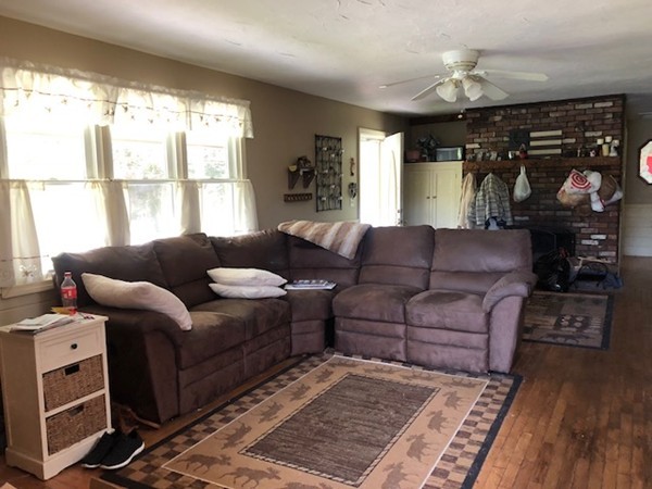 547 North Avenue Rochester, MA 02770 - Photo 8 of 26 a living room with furniture and a fireplace