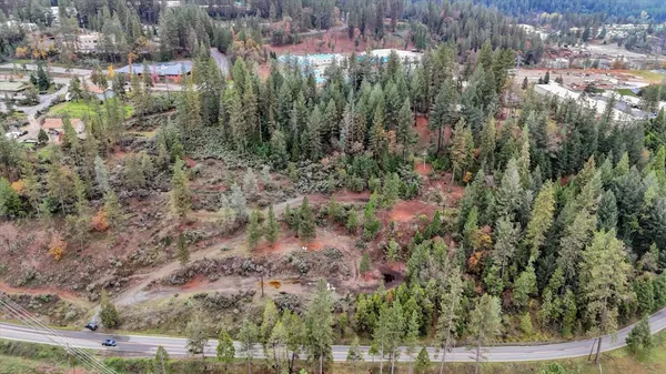 a view of a town with mountains in the background