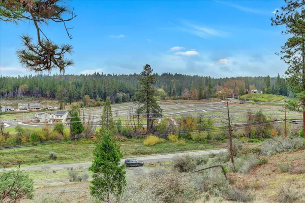 a view of a town with mountains in the background
