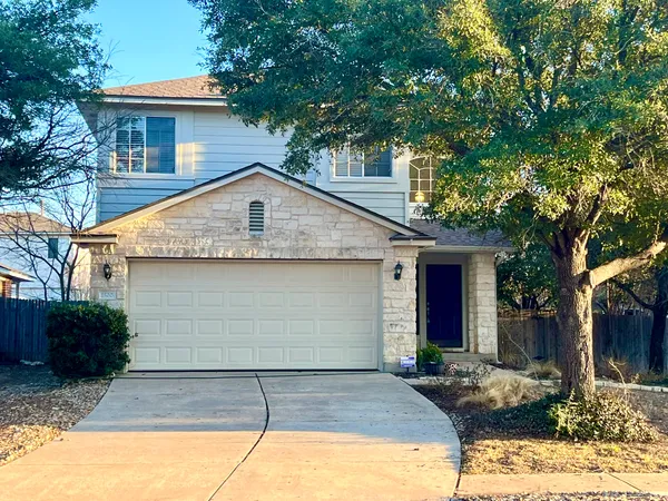 a front view of a house with garage