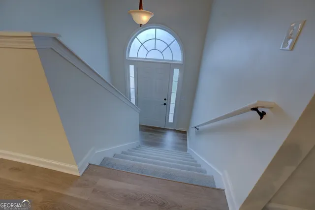 a view of a hallway view with staircase