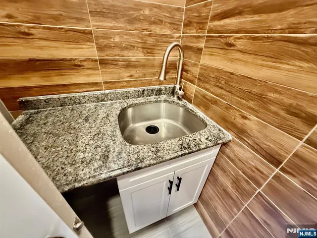 a bathroom with a sink a toilet and a shower