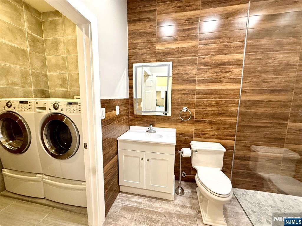 144 Centre Avenue Secaucus, NJ 07094 - Photo 14 of 22 a bathroom with a sink a toilet and a shower