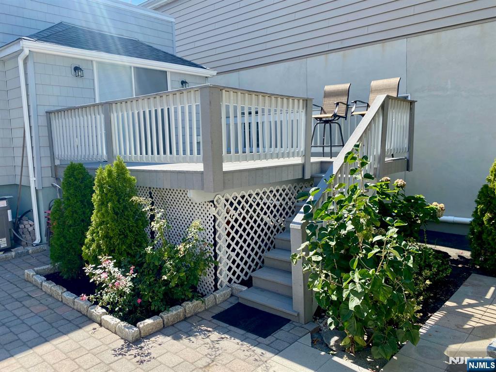 144 Centre Avenue Secaucus, NJ 07094 - Photo 16 of 22 a front view of a house with a garden