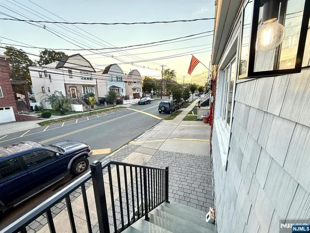 a view of street with parked cars