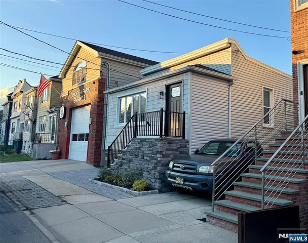 a view of a city street with a parked car