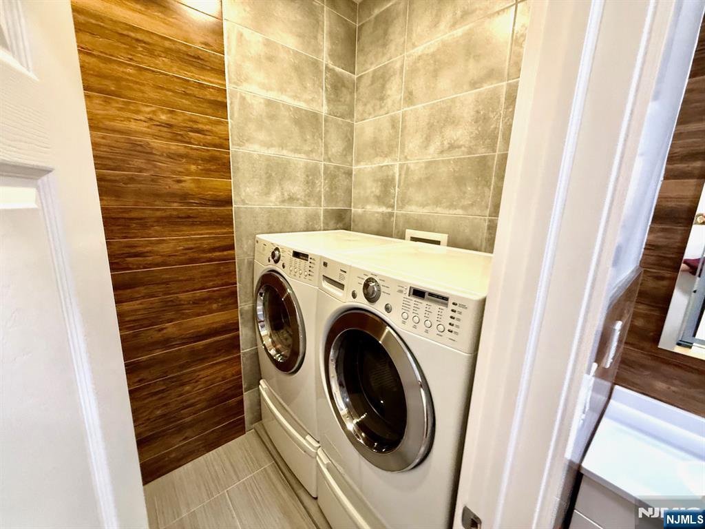144 Centre Avenue Secaucus, NJ 07094 - Photo 5 of 22 a utility room with dryer and washer