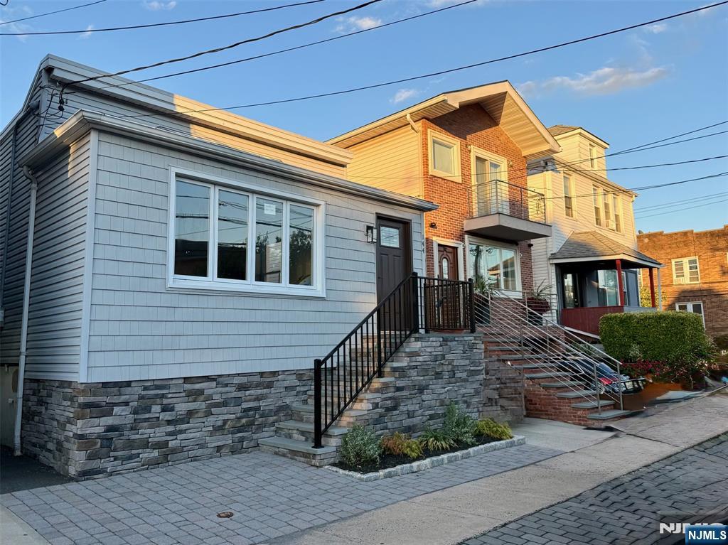 144 Centre Avenue Secaucus, NJ 07094 - Photo 6 of 22 a front view of a house with garden