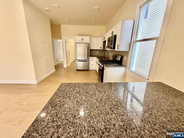 a view of a livingroom with a staircase
