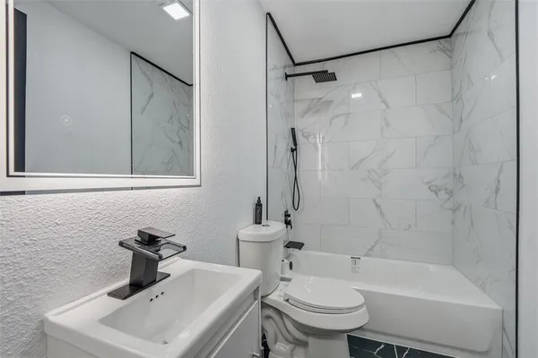 a bathroom with a shower and a sink