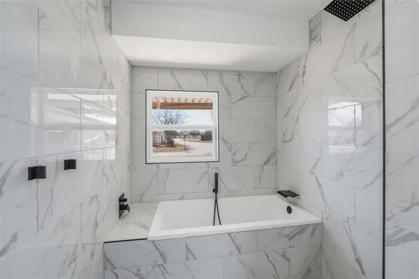 an empty room with a bathroom